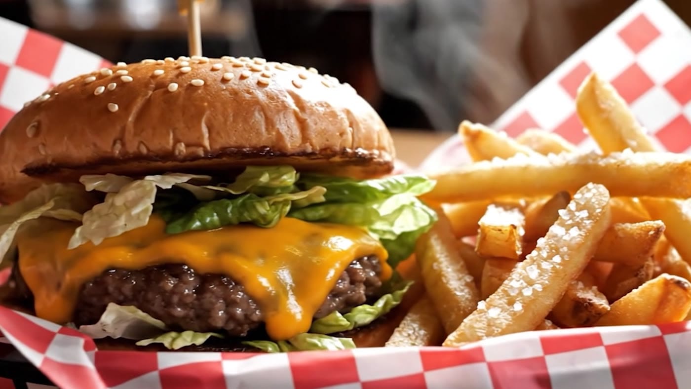 A burger and fries in a basket